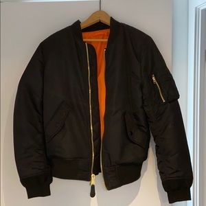 Alpha black and orange reversible bomber